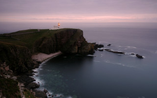 Lighthouse cliff ocean dusk pink - david begbie free wallpaper