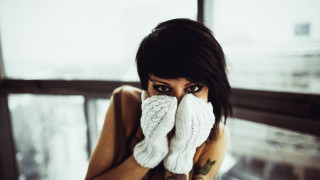 Woman glove covering face looking - a white glove free wallpaper