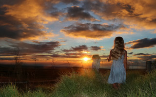 Woman sunset green field clouds - a fence free wallpaper for desktop