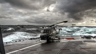 Helicopter ship ocean waves mountain - the background and a boat free wallpaper