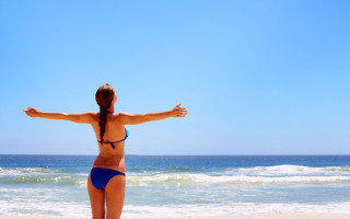 Woman beach bikini outstretched arms 2 - evaline ness free wallpaper