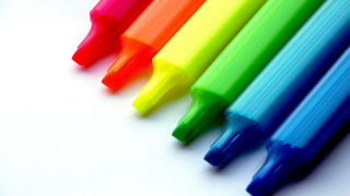 Multicolored pens white table synchromism - a white surface free wallpaper