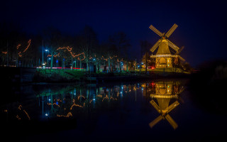 Windmill river reflections night cityscape - a windmill free wallpaper