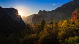 Sunshine mountains trees lake sky - rim light free wallpaper