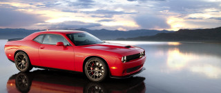 Red car reflective surface mountains - reflective free wallpaper