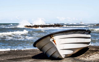 Boat beach ocean waves rocks - the background and a rock free wallpaper