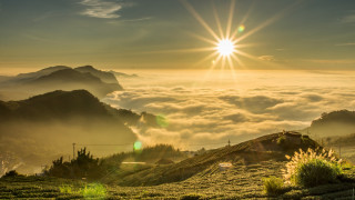 Sun mountain foggy valley crepuscular - over a mountain range free wallpaper