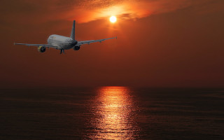 Plane ocean sunset backlit matte - a plane free wallpaper