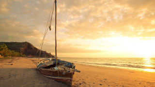Beach sunset boat person cloud - the beach in the foreground free wallpaper