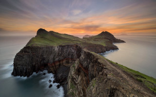 Cliff water sunset clouds mountain - a large cliff free wallpaper