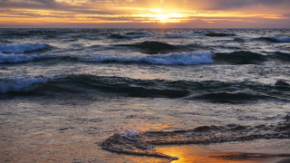 Sunset ocean waves beach person 4 - the beach in the distance free wallpaper