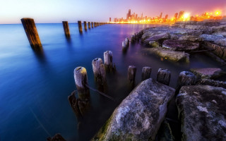 City skyline rocky shore dusk - alson s. clark free wallpaper