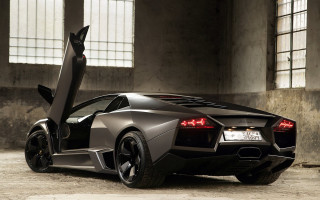 Black sports car garage door - its door open free wallpaper
