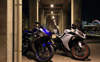 Motorcycles parking lot night city - the building free wallpaper