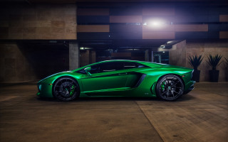 Green sports car parking garage 2 - a green sports car free wallpaper