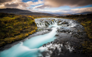 River flowing green forest cloudy - a lush green forest under a cloudy sky free wallpaper