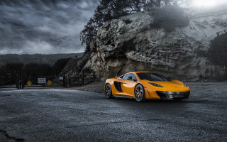 Yellow sports car mountain night - a dark cloud in the sky free wallpaper