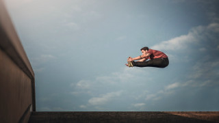 Man flying skateboard ramp building - a skateboard free wallpaper