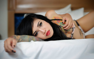 Tattooed woman bed white sheets - a white sheet free wallpaper