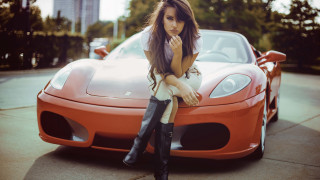 Woman sitting hood sportscar fashion - her chin free wallpaper