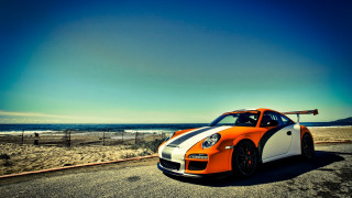 Sports car ocean fence surfboard - a sports car free wallpaper