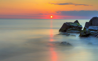 Sunset ocean rocks orange sun - a sunset over the ocean free wallpaper for desktop