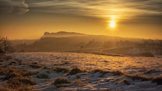 Snowy hill sunset cityscape ocean - a snowy field free wallpaper