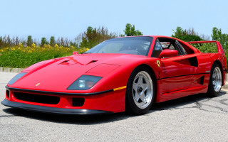 Red sports car parking lot 38 - a field of flowers and trees free wallpaper