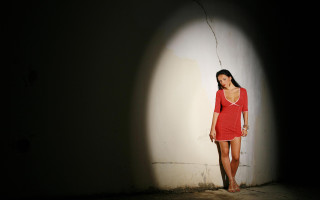 Woman red dress shadow backlighting - the wall behind her free wallpaper