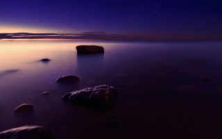 Purple water rocks night sky - a few star free wallpaper