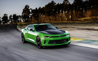 Green car forest road mountain - a green car free wallpaper