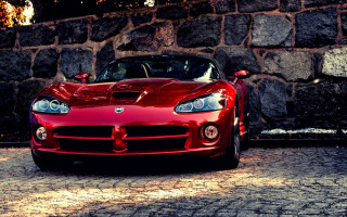 Red sports car stone wall 2 - a brick wall free wallpaper