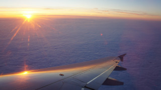 Sunset ocean clouds plane view - anamorphic free wallpaper