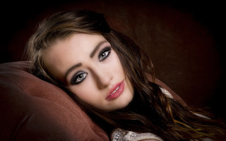 Blue eyes brown jacket portrait - a brown jacket free wallpaper for desktop