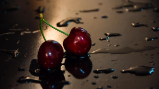 Cherry shiny surface water drops - a shiny surface free wallpaper