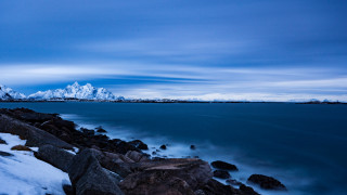 Rocky shore snow mountains night - cinematic landscape free wallpaper