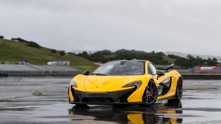 Yellow sports car wet road 3 - a wet road in the rain free wallpaper