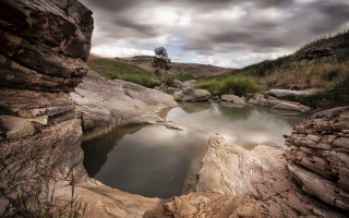 Small pool rocky area cloudy - a rocky area free wallpaper for desktop