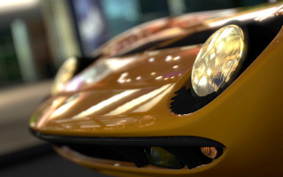 Yellow sports car closeup blurry - f 8 aperture free wallpaper