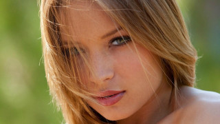 Woman blowing hair posing photorealistic - realistic shaded perfect face free wallpaper