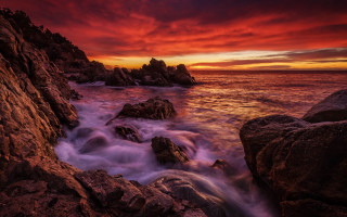 Red sky ocean rocks water - sunset time free wallpaper