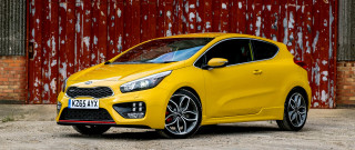 Yellow car red wall red - a red brick wall behind free wallpaper