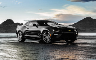 Black chevrolet camaro mountains cloudy - photorealistic lighting free wallpaper