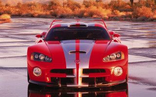 Red sports car autumn leaves 8 - a reflection of the car free wallpaper