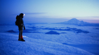 Man snowy mountain slope dusk - top of a snow free wallpaper