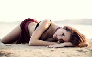 Beach bikini woman laying sand - a character portrait free wallpaper for desktop