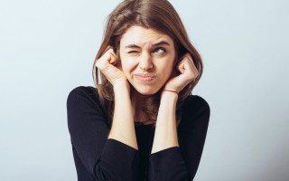 Surprised woman hands to ears - character portrait free wallpaper