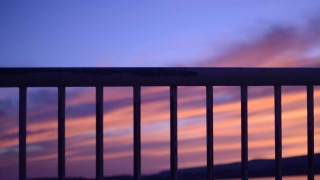 Sunset balcony fence bench pink - sky in the background free wallpaper