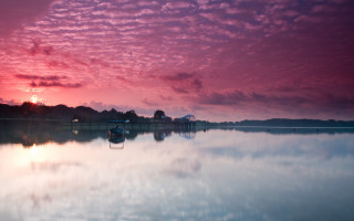 Boat sunset water pink clouds - moody free wallpaper