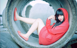 Woman red hoodie sitting pipe - chen chi free wallpaper